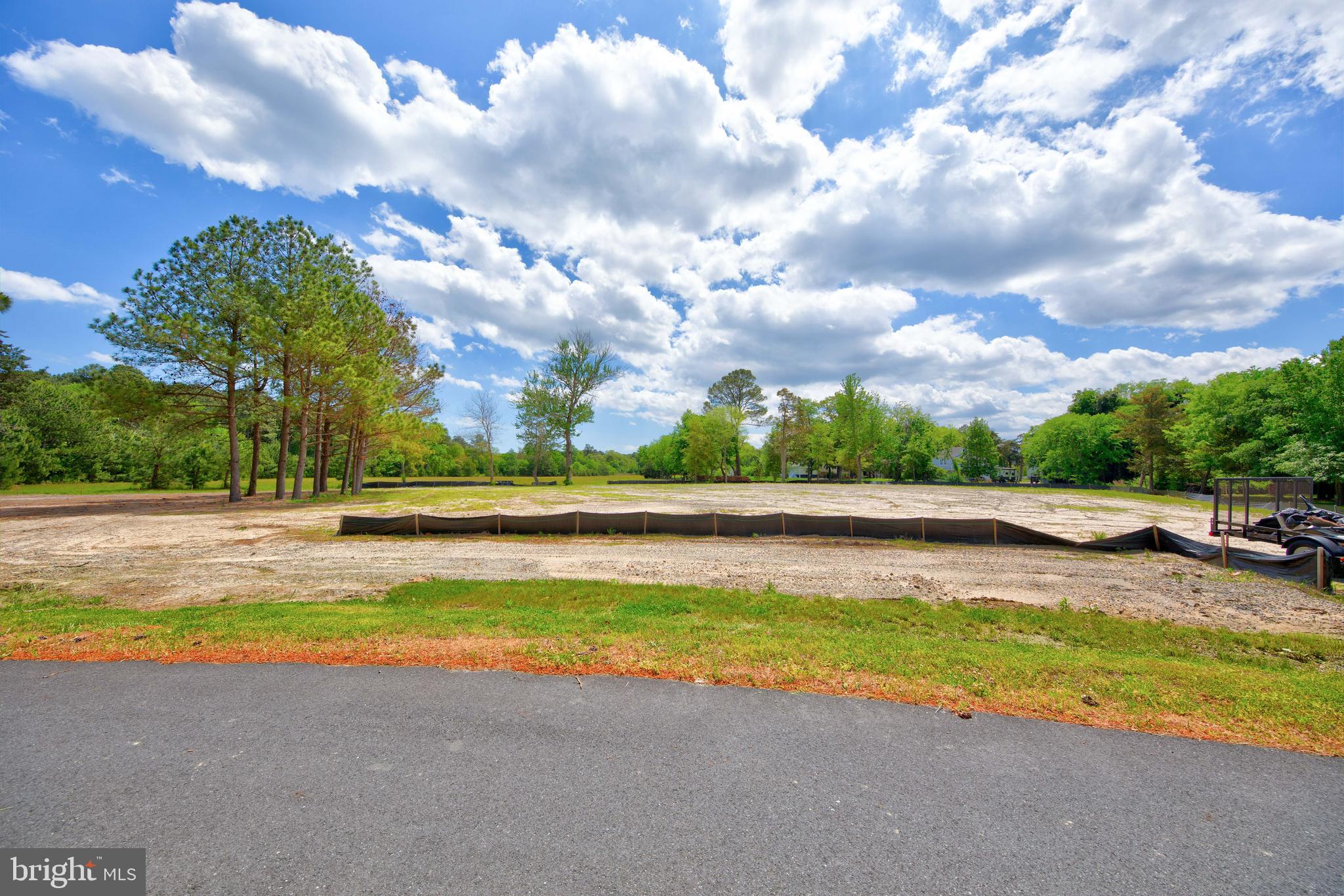 31772 Stevensons Road Dagsboro, DE 19939 - Photo 13 of 17 a view of a swimming pool with an outdoor seating and a yard