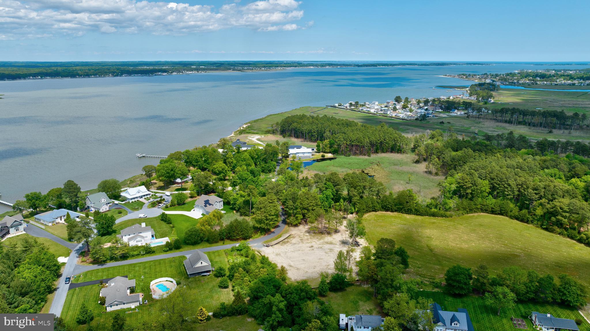 31772 Stevensons Road Dagsboro, DE 19939 - Photo 5 of 17 a view of a lake with a city