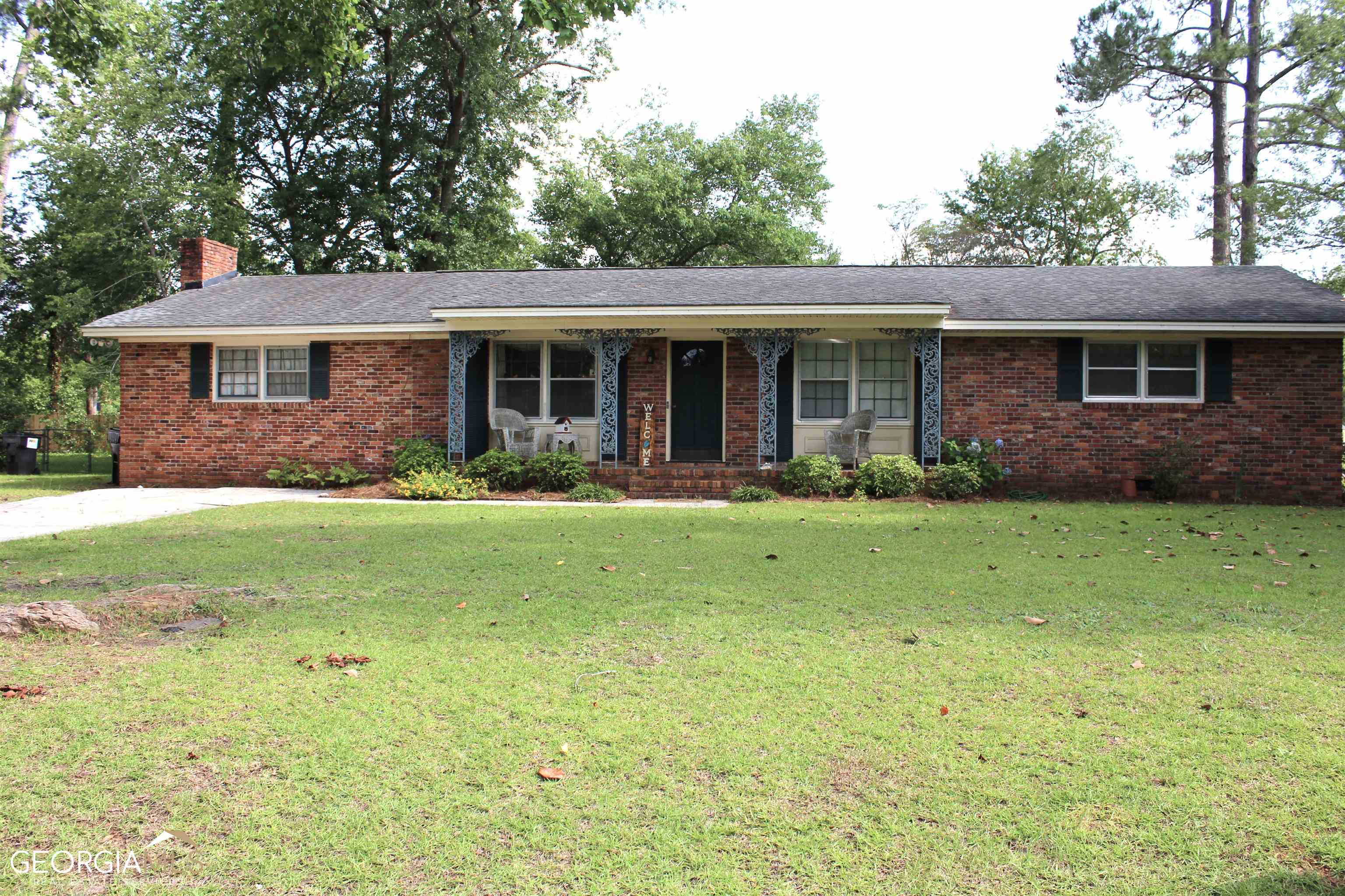 1500 Windsor Road Perry, GA 31069 - Photo 1 of 1 a front view of house with yard and green space