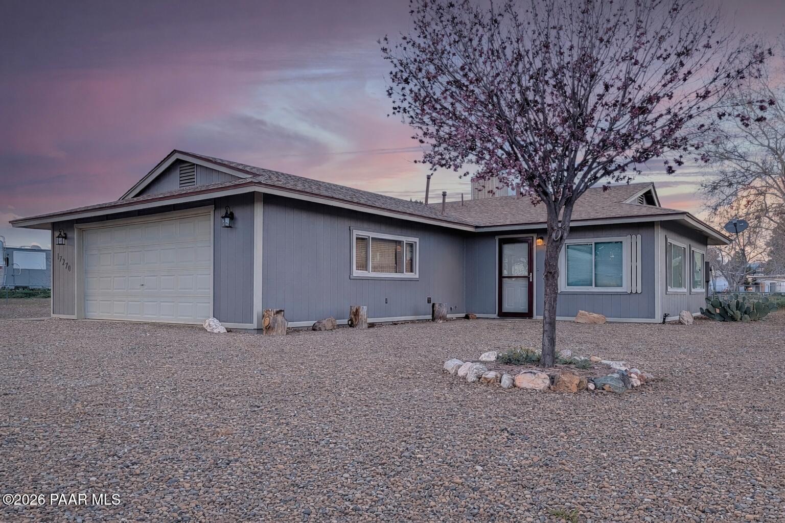 17270 East Peach Tree Road Mayer, AZ 86333 - Photo 1 of 31 a house with trees in the background