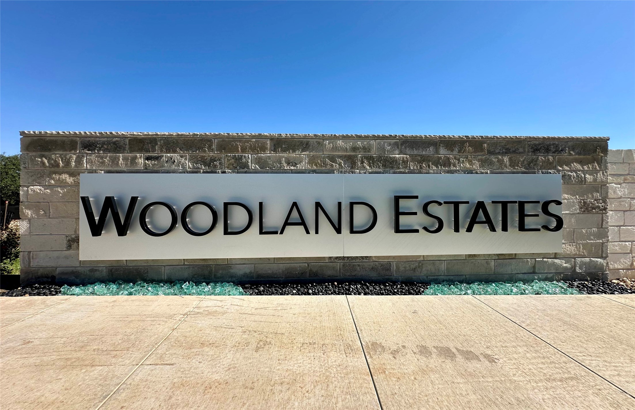 2201 Council Springs Pass Leander, TX 78641 - Photo 19 of 21 a wooden sign on the wall of building