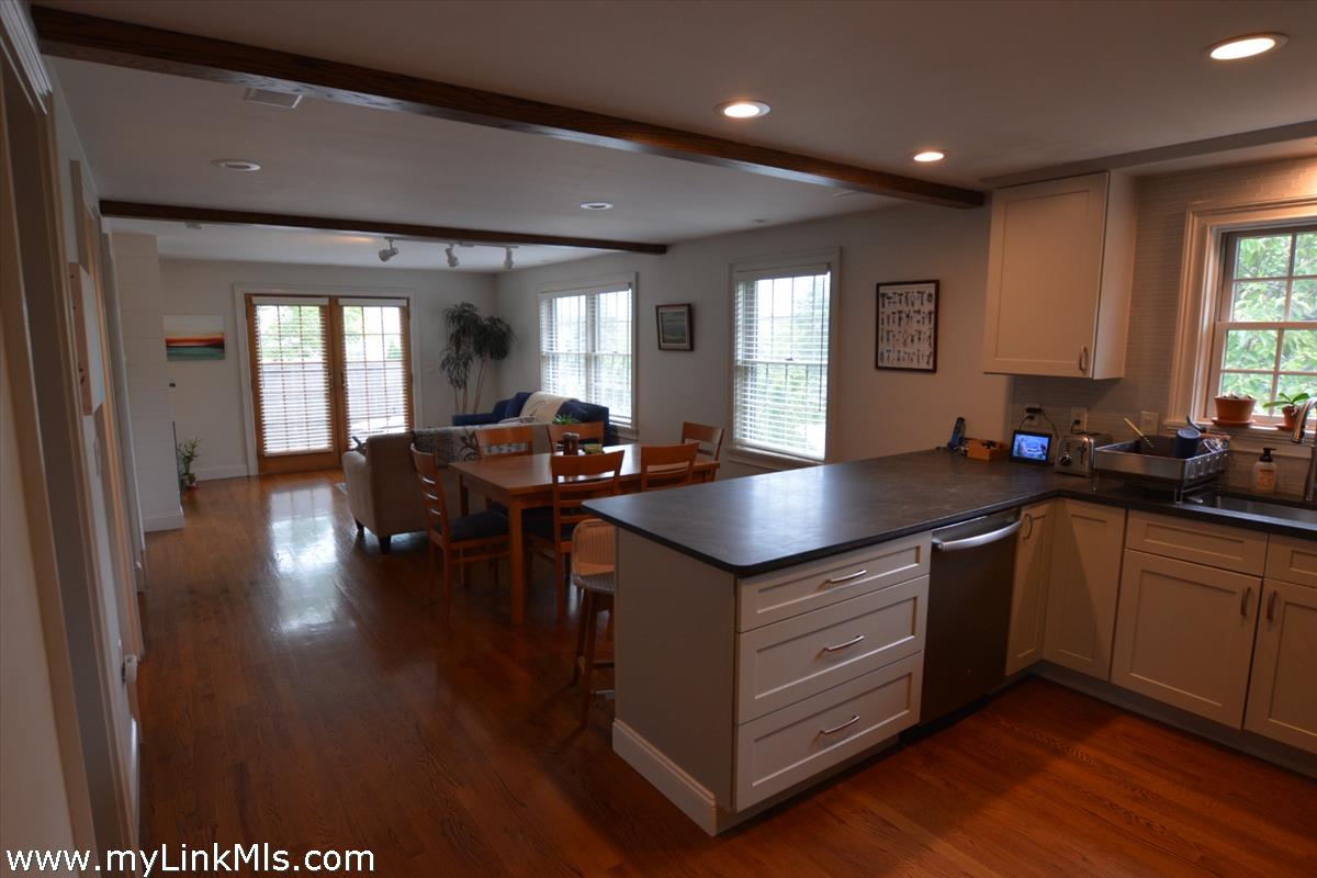 11 Waydale Road Nantucket, MA 02554 - Photo 2 of 24 Second floor open living/dining/ kitchen w french doors to deck.