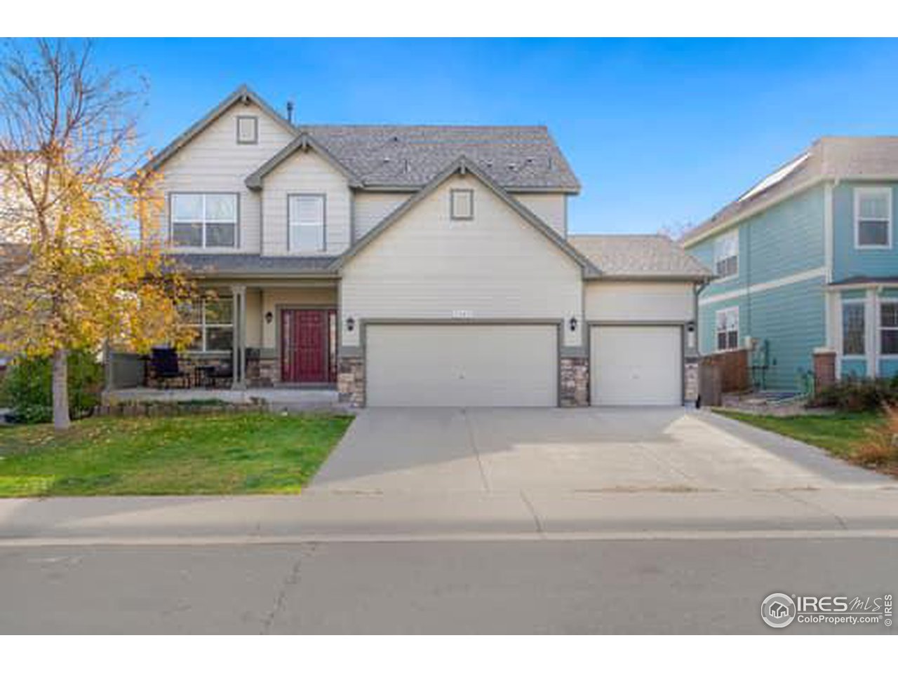 1545 Edenbridge Drive Windsor, CO 80550 - Photo 1 of 28 a front view of a house with a yard and garage