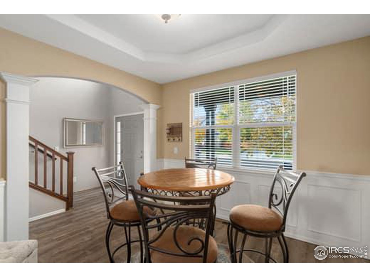 1545 Edenbridge Drive Windsor, CO 80550 - Photo 4 of 28 a dining room with furniture and wooden floor