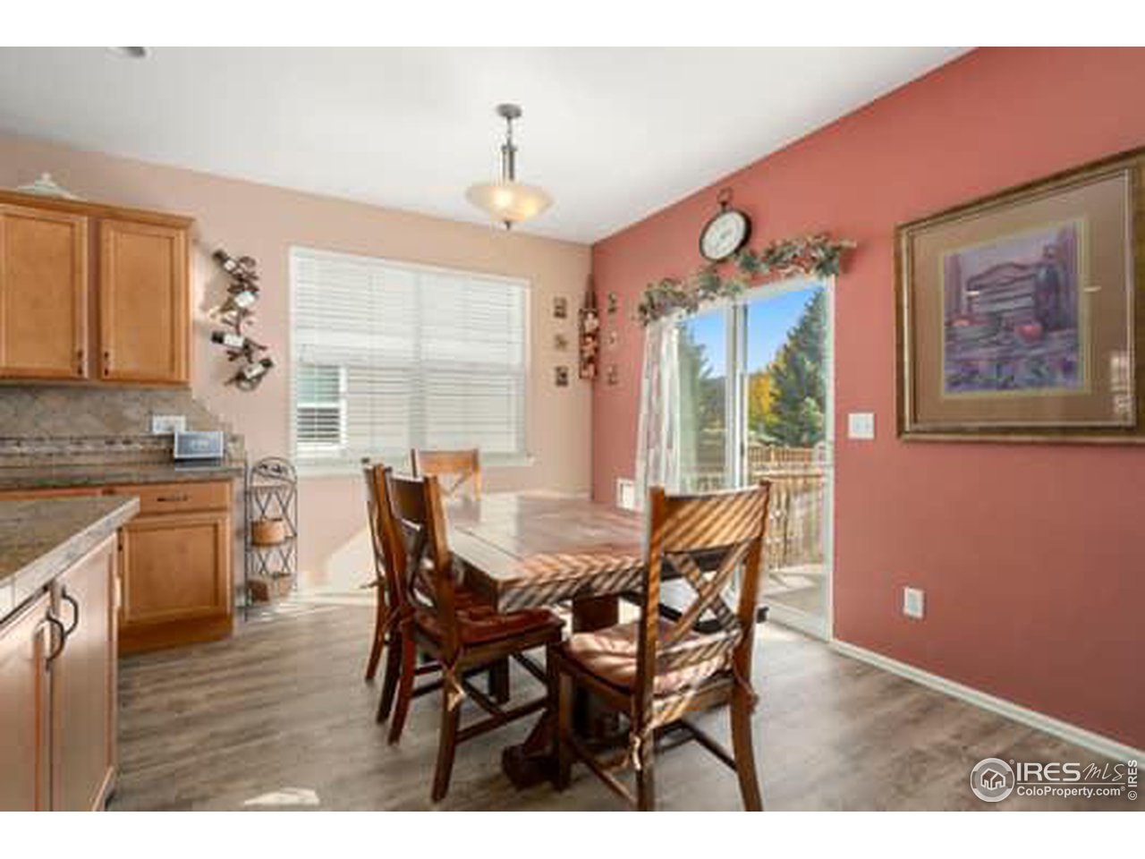 1545 Edenbridge Drive Windsor, CO 80550 - Photo 9 of 28 a view of a dining room with furniture window and outside view