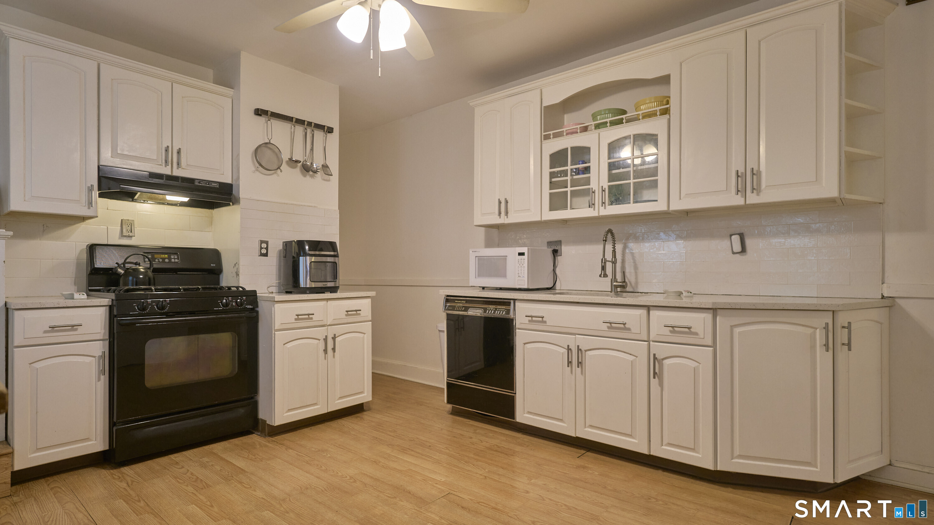 181 Buckingham Street Waterbury, CT 06710 - Photo 11 of 38 a kitchen with stainless steel appliances granite countertop a stove sink and cabinets