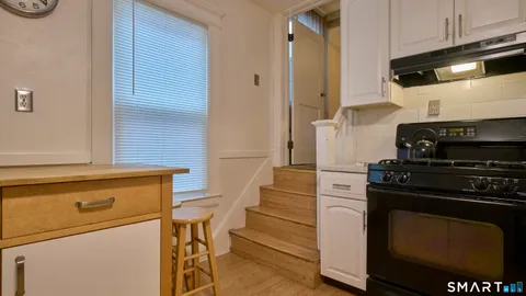 a kitchen with a stove and a refrigerator