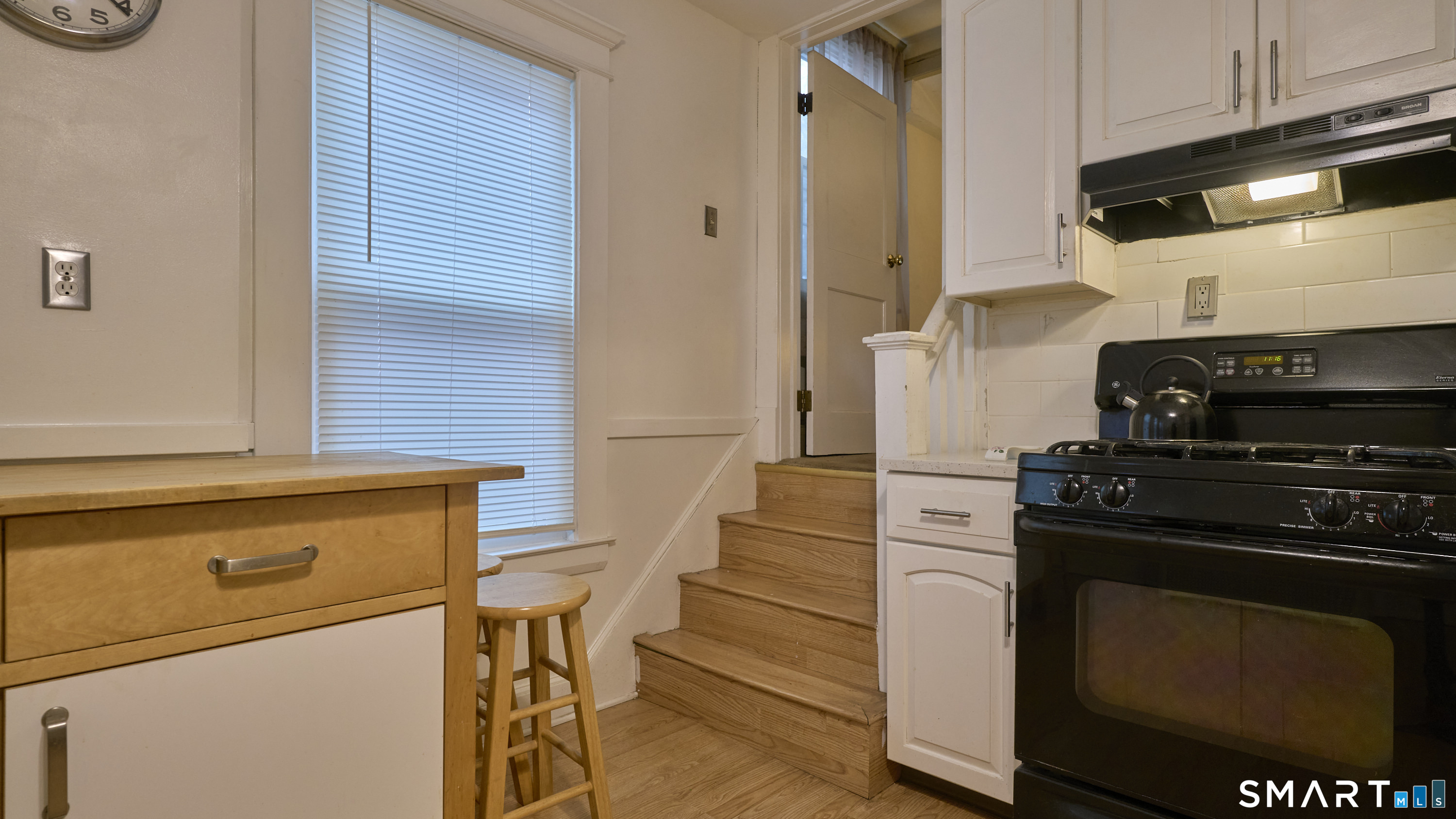 181 Buckingham Street Waterbury, CT 06710 - Photo 13 of 38 a kitchen with a stove and a refrigerator