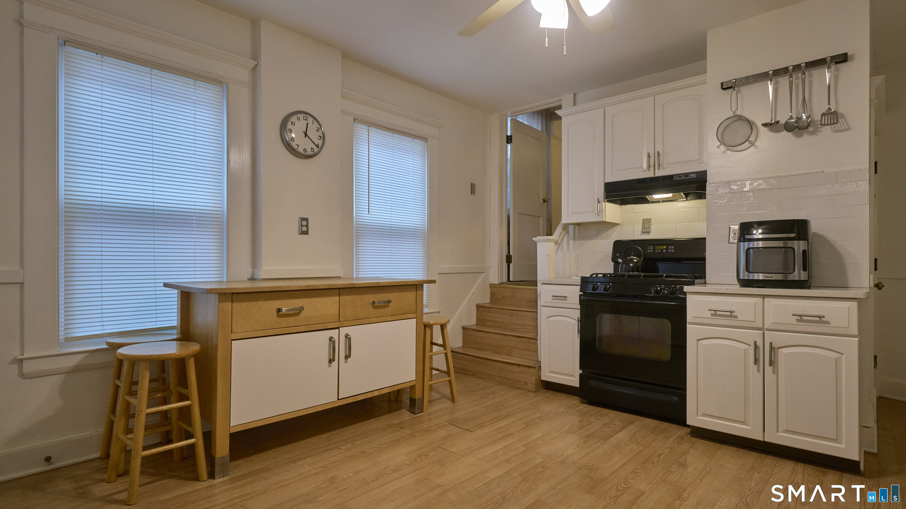 181 Buckingham Street Waterbury, CT 06710 - Photo 14 of 38 a kitchen with stainless steel appliances granite countertop a stove and cabinets