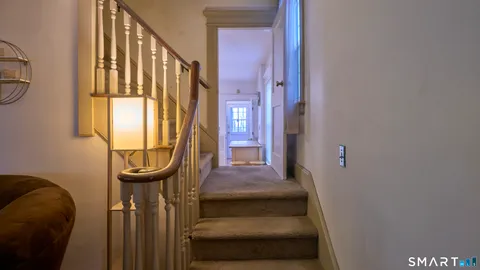 a bedroom with a bed and a car