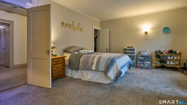 a room with a dresser and a mirror