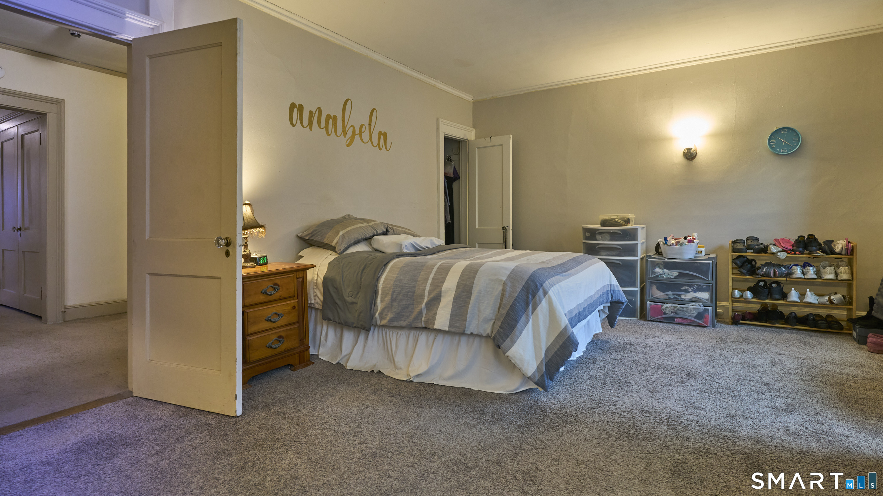 181 Buckingham Street Waterbury, CT 06710 - Photo 18 of 38 a bedroom with a bed and a car