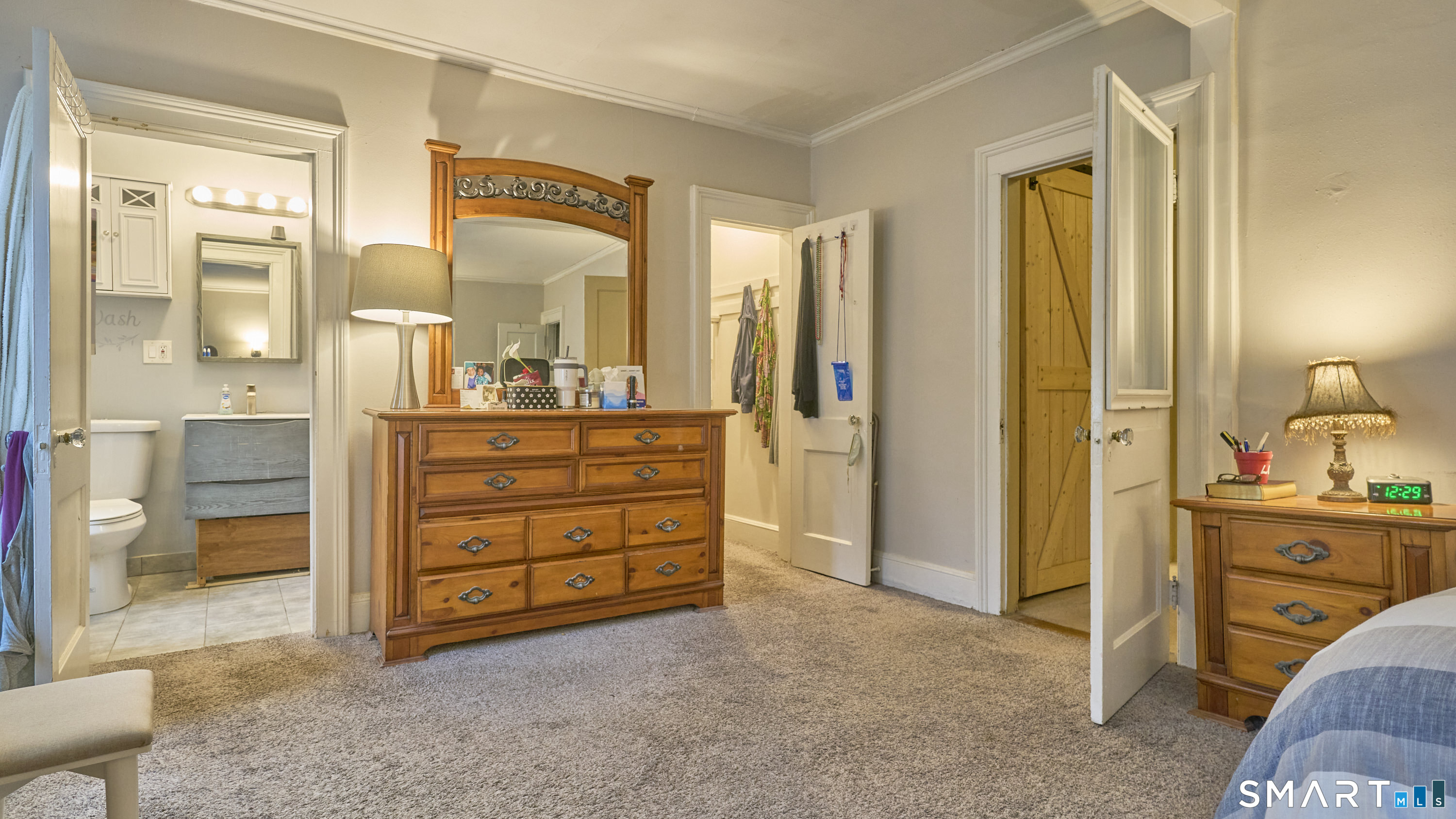 181 Buckingham Street Waterbury, CT 06710 - Photo 19 of 38 a room with a dresser and a mirror