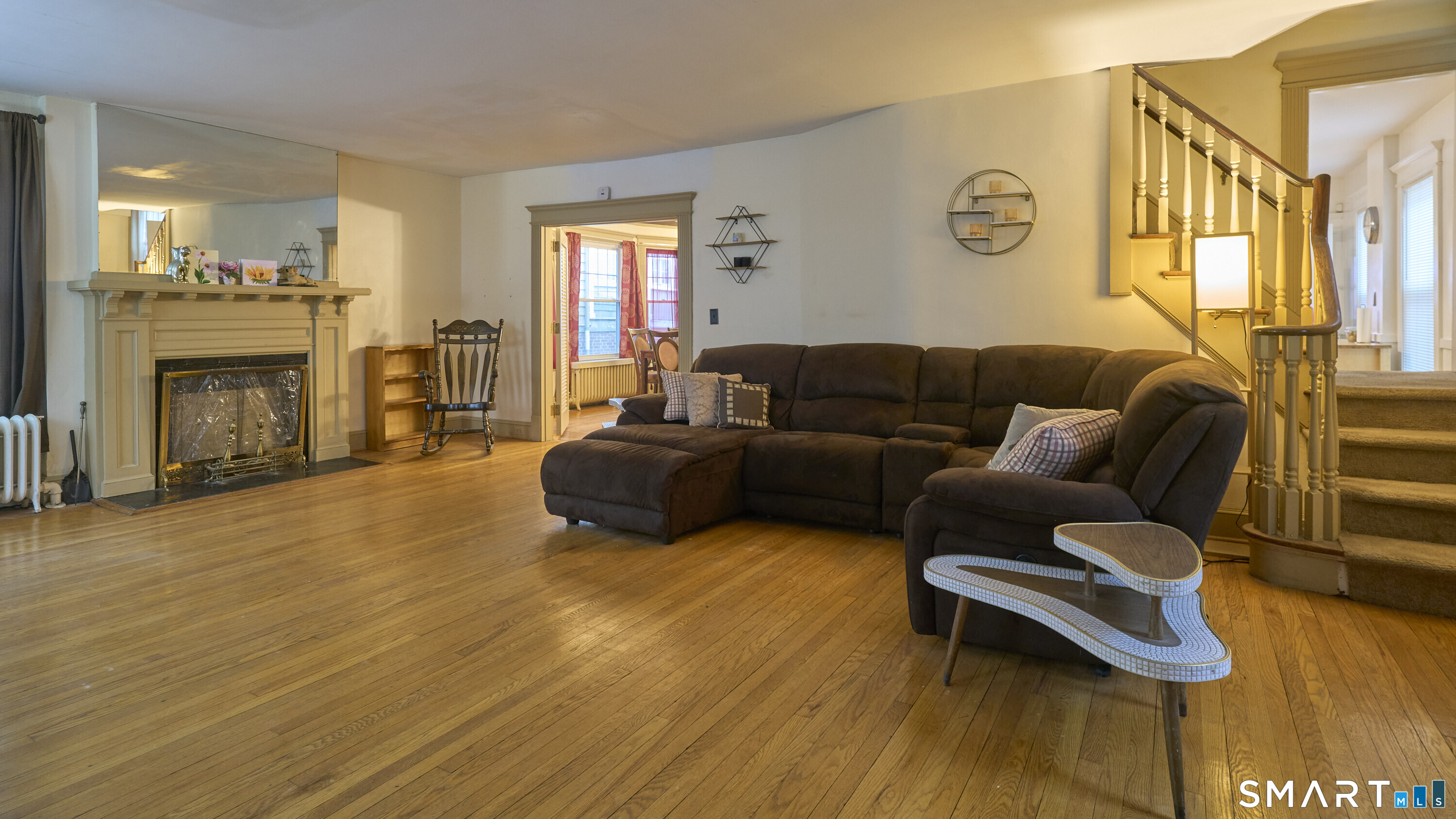 181 Buckingham Street Waterbury, CT 06710 - Photo 2 of 38 a living room with furniture and a fireplace