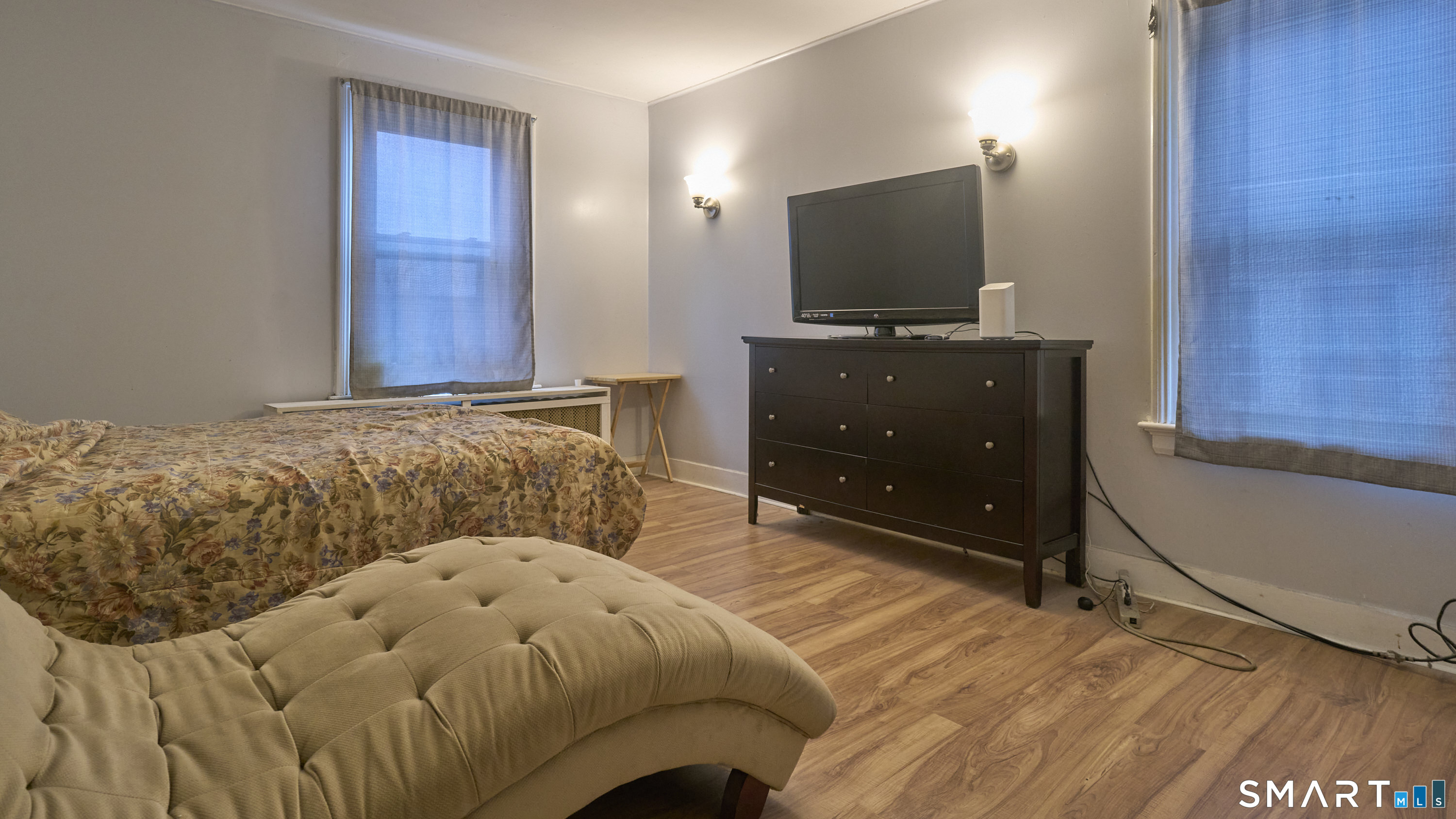 181 Buckingham Street Waterbury, CT 06710 - Photo 21 of 38 a bedroom with a bed and a flat screen tv