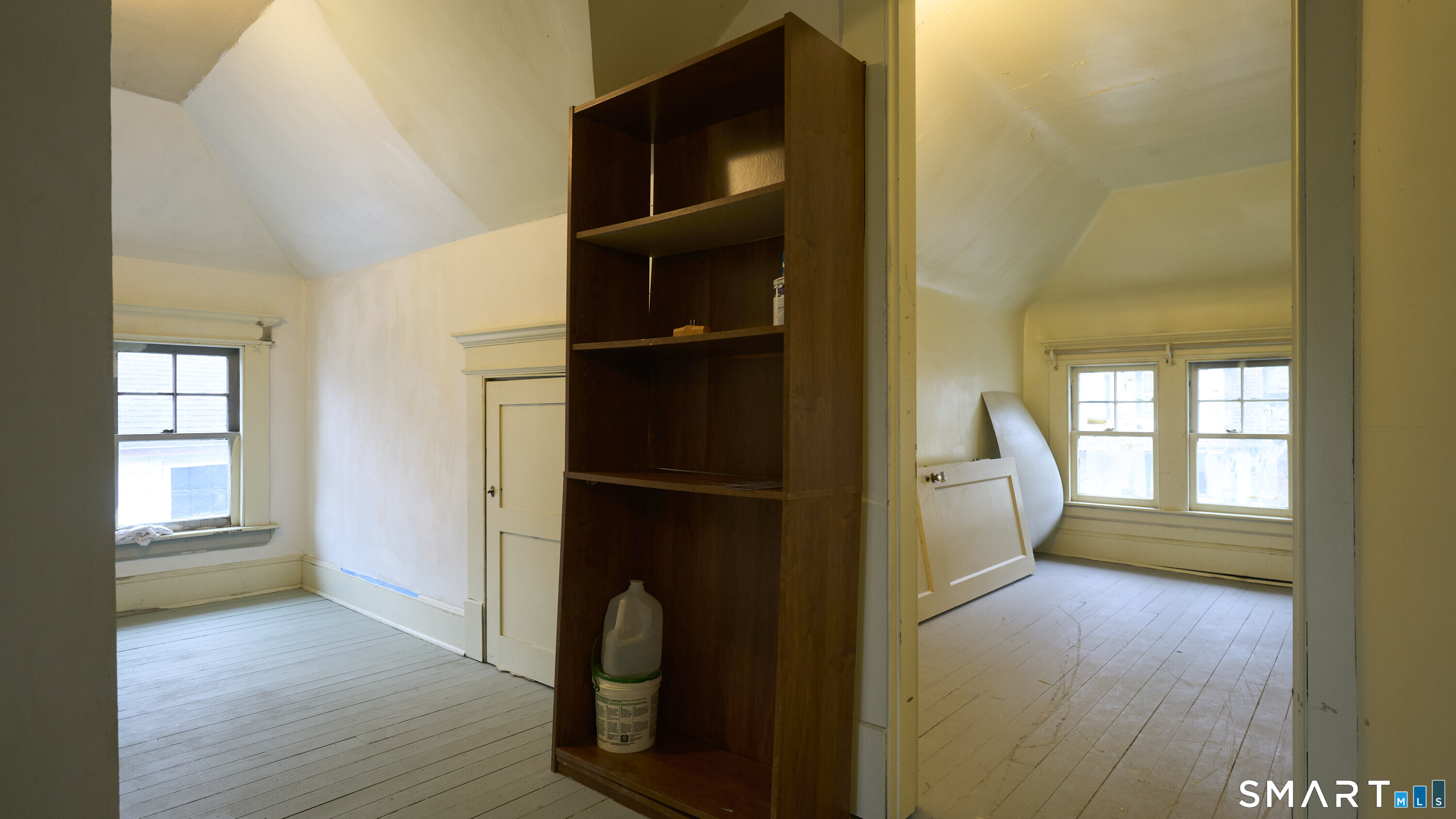 181 Buckingham Street Waterbury, CT 06710 - Photo 30 of 38 a view of walk in closet with window and wooden floor