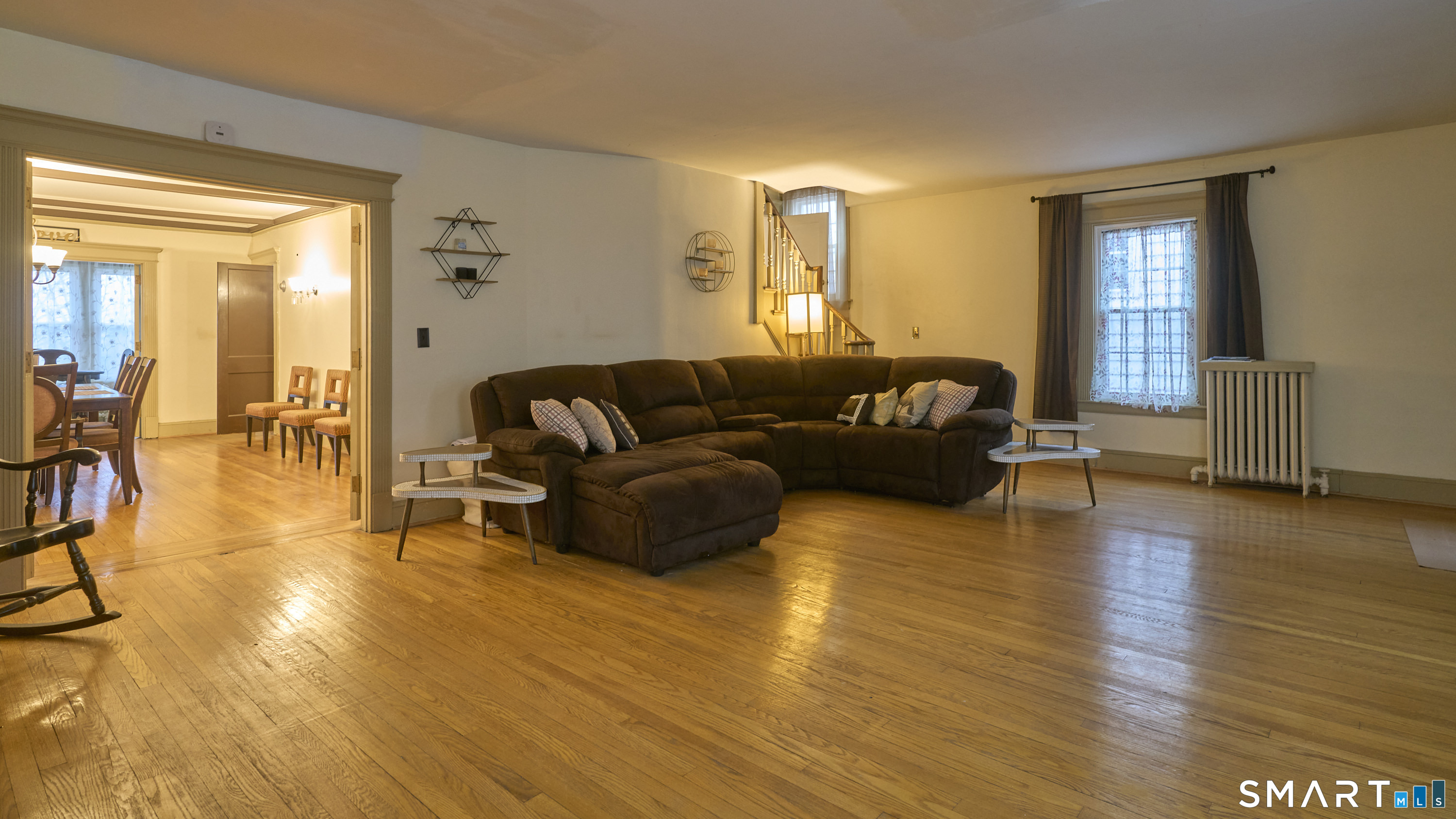 181 Buckingham Street Waterbury, CT 06710 - Photo 3 of 38 a living room with furniture and a wooden floor