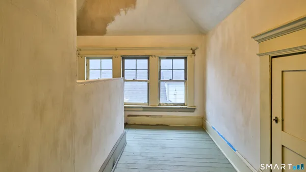 a view of entryway with wooden floor