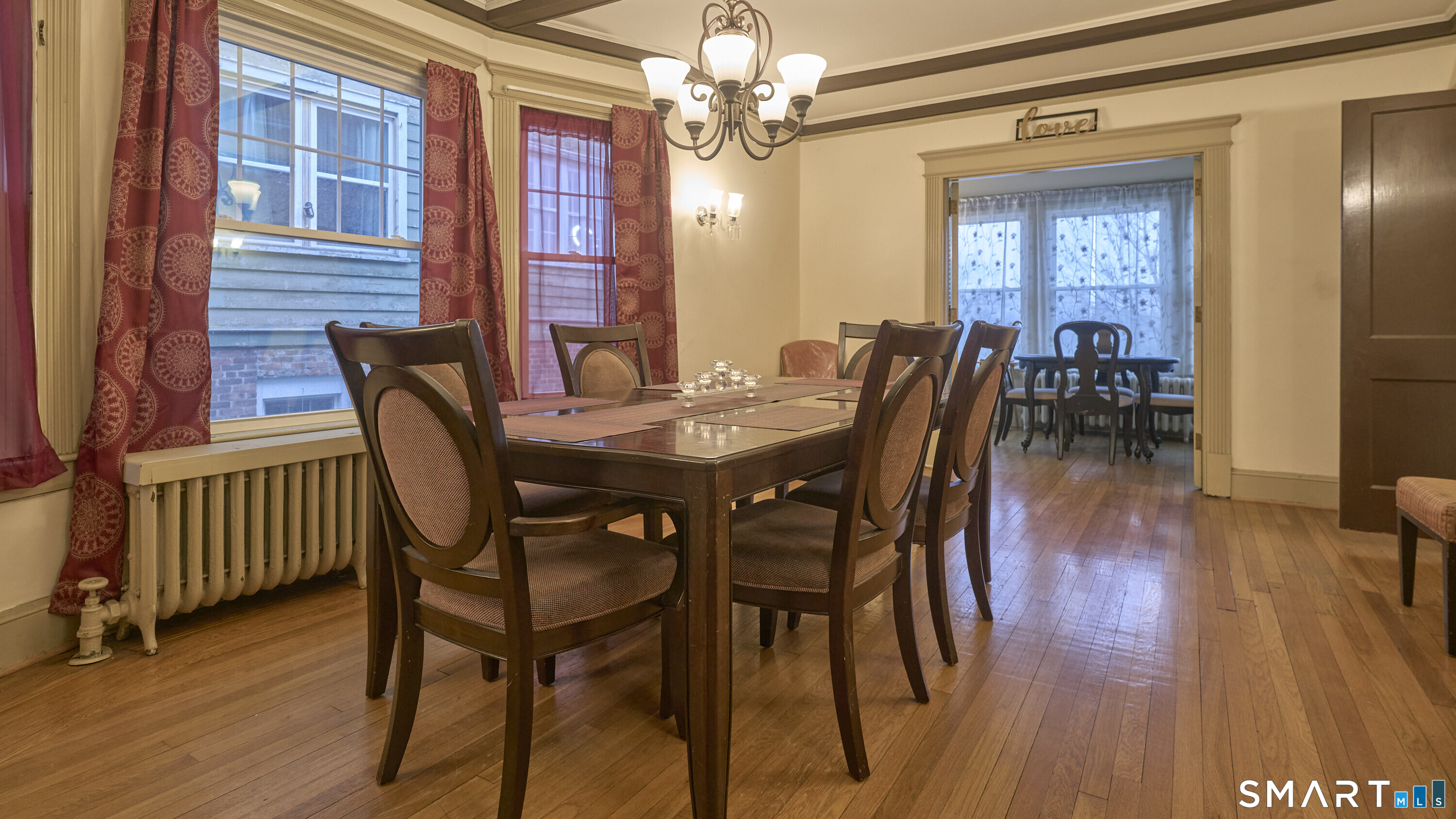 181 Buckingham Street Waterbury, CT 06710 - Photo 5 of 38 a view of a a dining room with furniture window and wooden floor