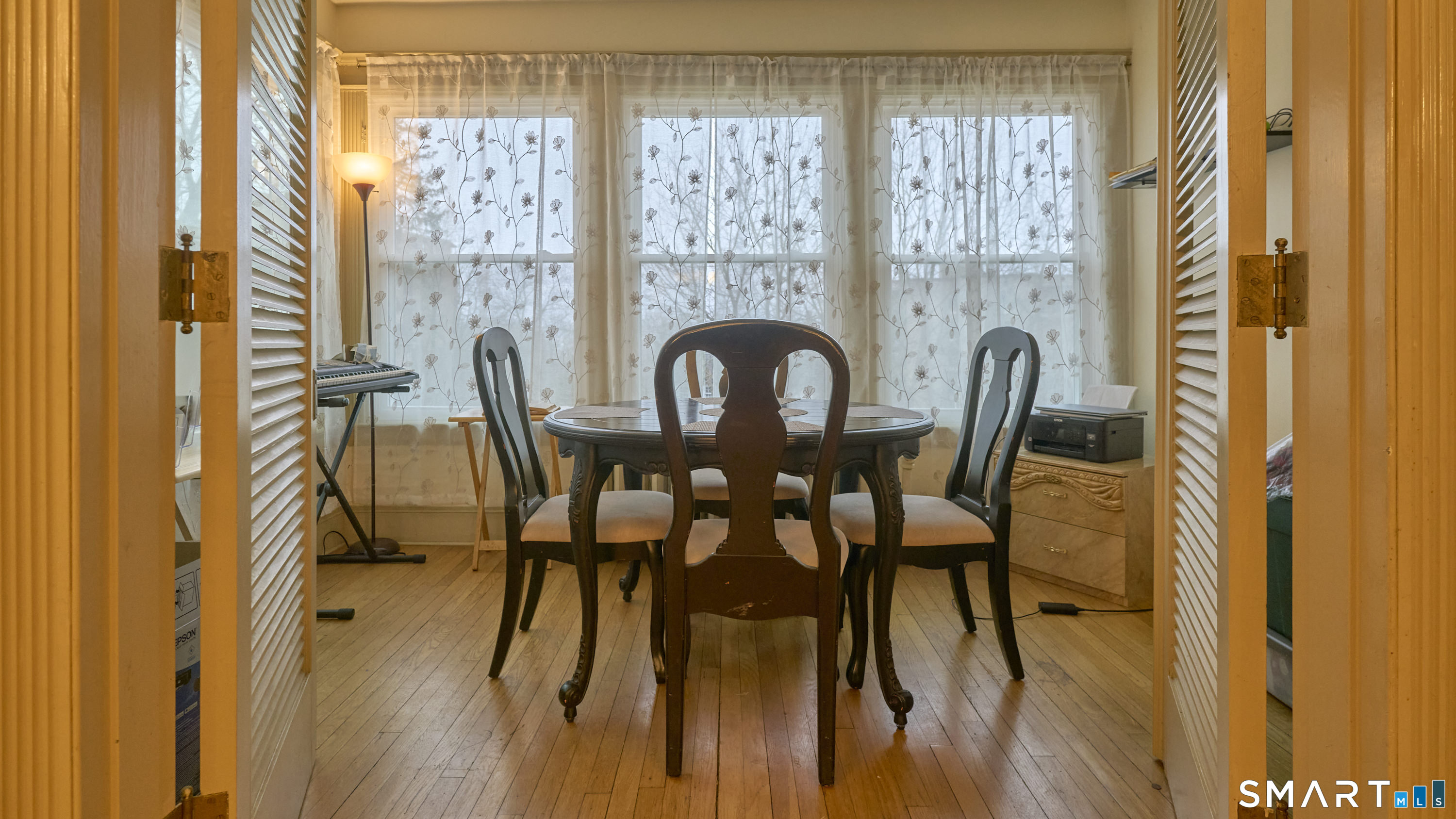 181 Buckingham Street Waterbury, CT 06710 - Photo 7 of 38 a view of a dining room with furniture window and wooden floor