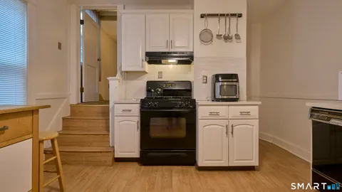 a kitchen with a stove and a microwave