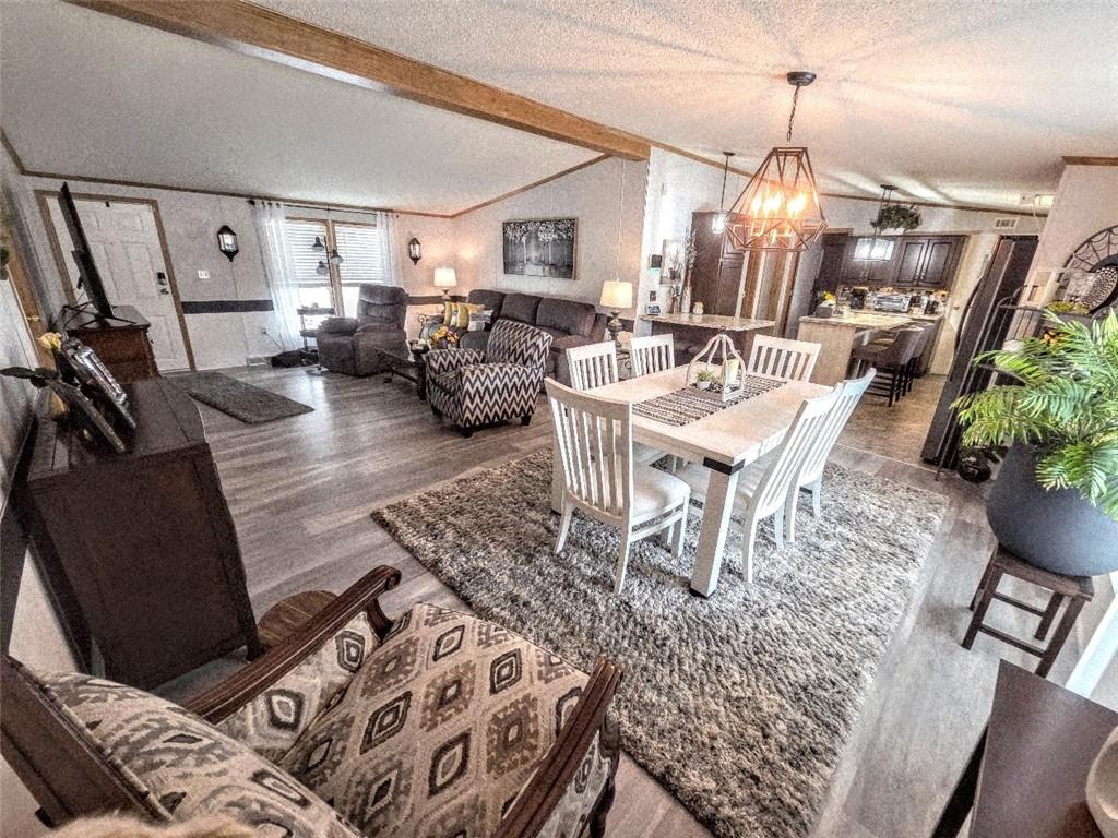 105 Eagle Pointe Estates New Eagle, PA 15067 - Photo 14 of 39 a living room with furniture and a chandelier