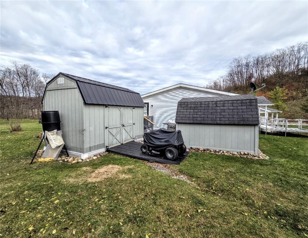 105 Eagle Pointe Estates New Eagle, PA 15067 - Photo 36 of 39 a view of a backyard with sitting area and garage