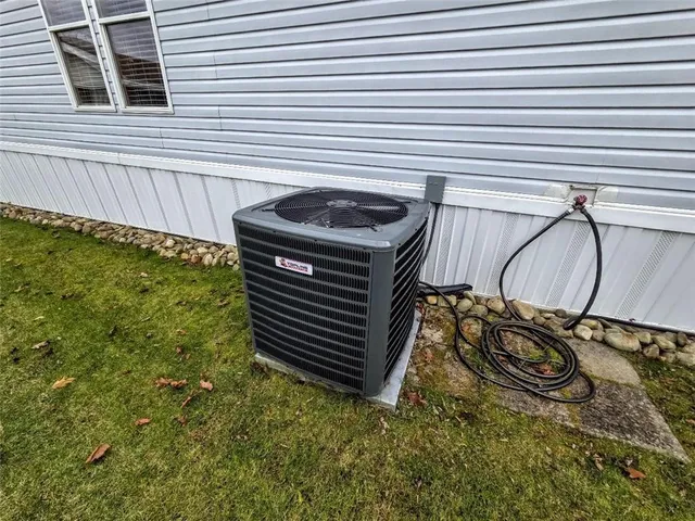 a view of a backyard with a chair