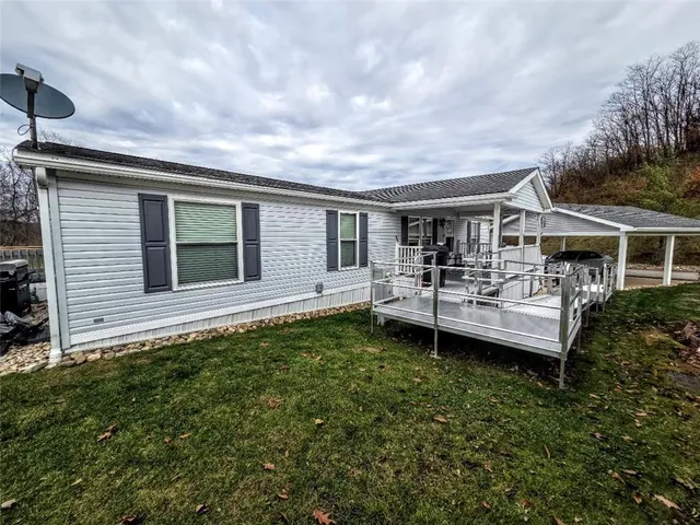 a backyard of a house with yard barbeque oven and outdoor seating