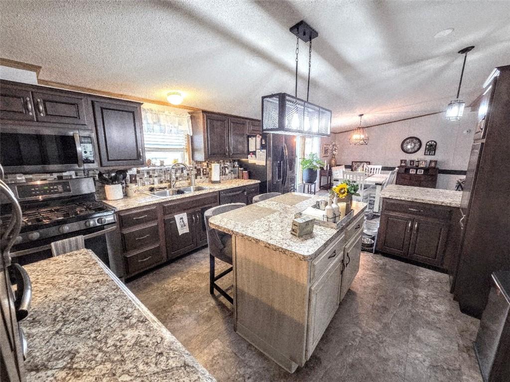 105 Eagle Pointe Estates New Eagle, PA 15067 - Photo 6 of 39 a kitchen with a stove a refrigerator and a microwave