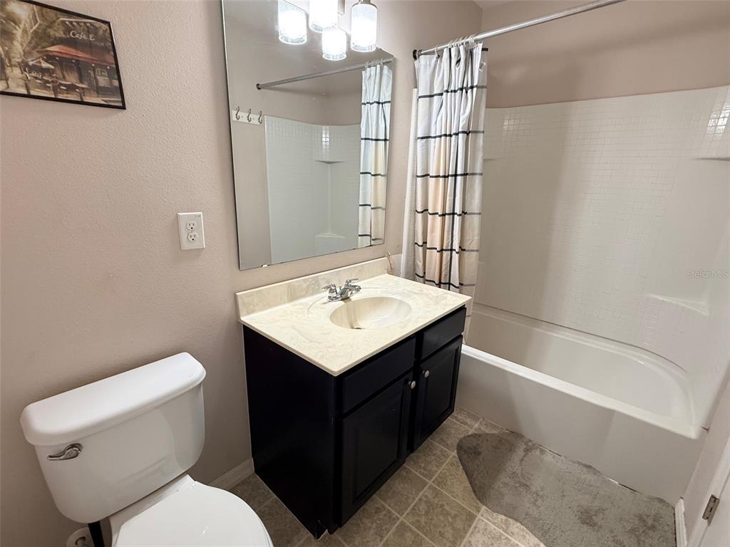 2084 Water Tupelo Way Ocoee, FL 34761 - Photo 20 of 34 a bathroom with a sink toilet and shower