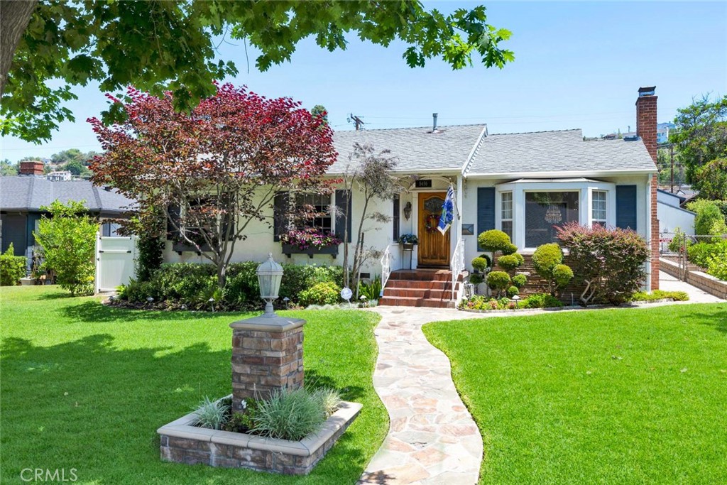 5456 Cadbury Road Whittier, CA 90601 - Photo 65 of 67 a front view of a house with a yard