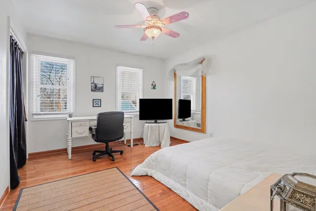 a bedroom with a workspace