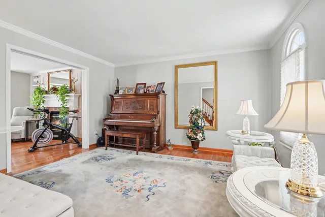 a living room with furniture a window and a table