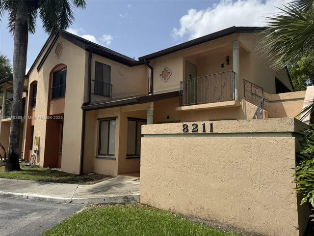 a view of a house with a street