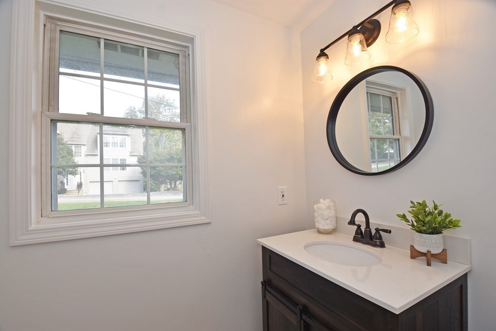 17 Ludlow Street Worcester, MA 01603 - Photo 12 of 23 a bathroom with a sink and a mirror