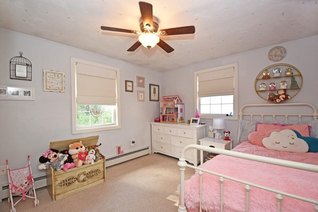 17 Ludlow Street Worcester, MA 01603 - Photo 13 of 23 a bedroom with a bed and a chandelier