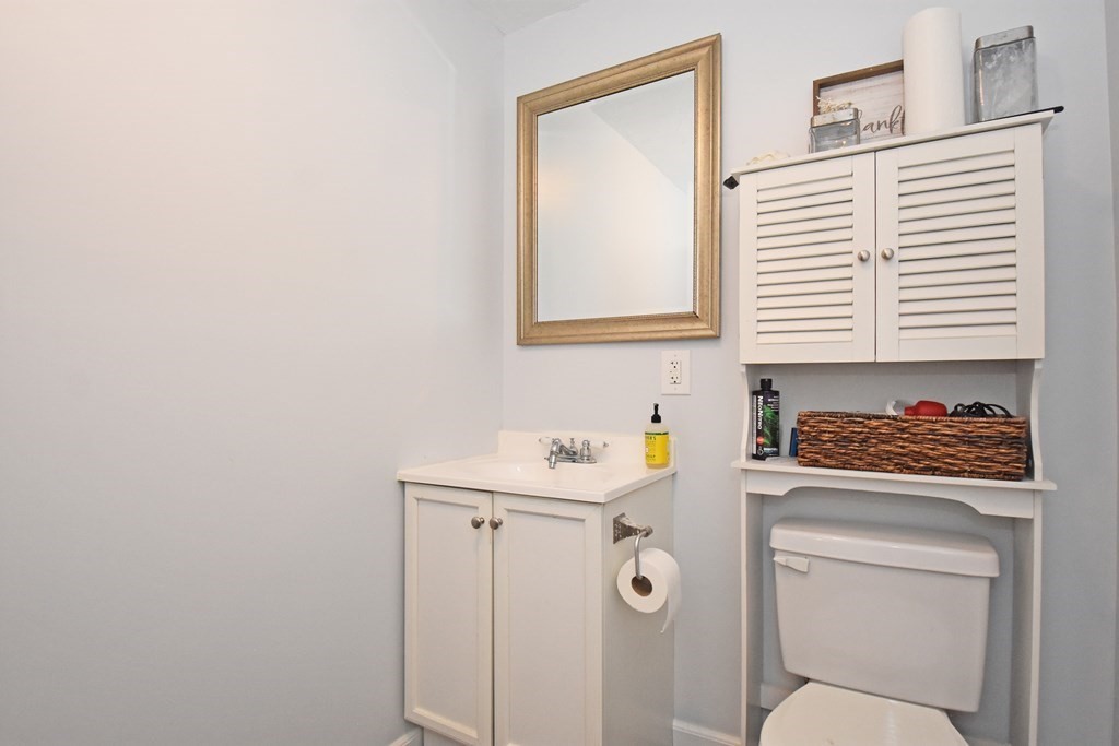 17 Ludlow Street Worcester, MA 01603 - Photo 18 of 23 a bathroom with a toilet sink and mirror