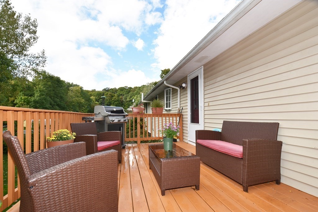 17 Ludlow Street Worcester, MA 01603 - Photo 21 of 23 a balcony with furniture and wooden floor