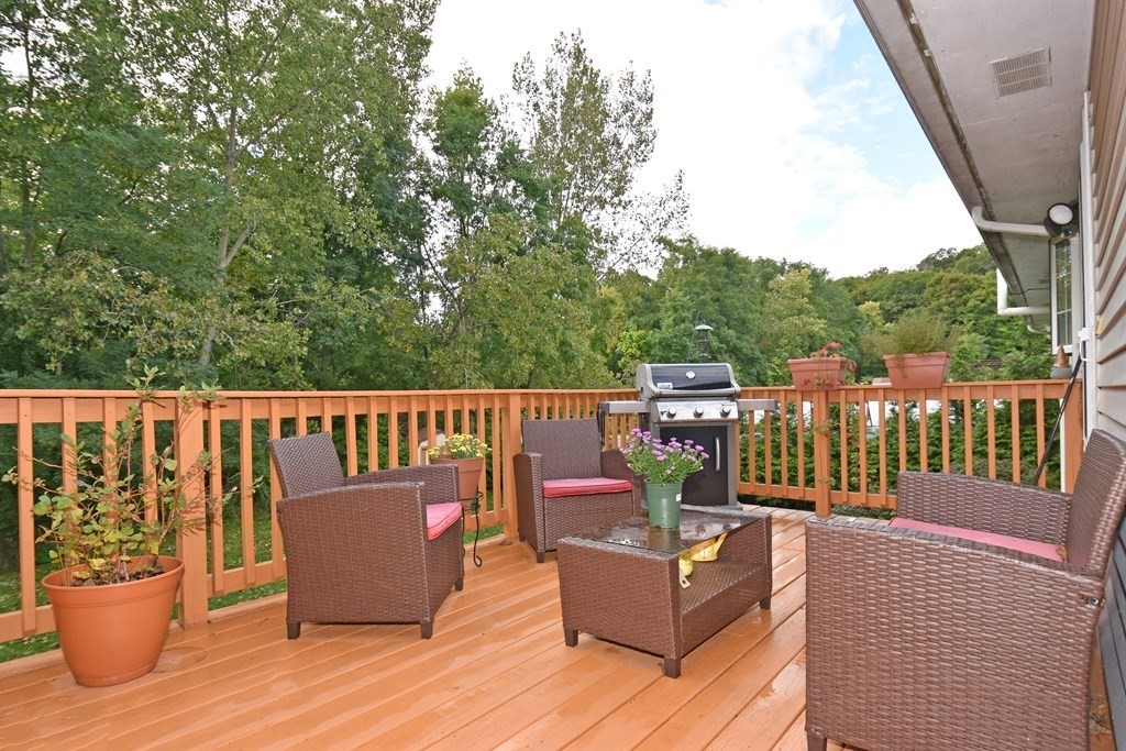 17 Ludlow Street Worcester, MA 01603 - Photo 22 of 23 a view of a deck with two chair and a potted plant