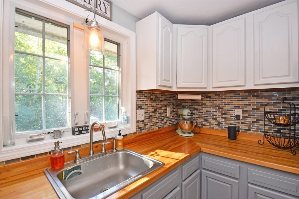 17 Ludlow Street Worcester, MA 01603 - Photo 5 of 23 a kitchen with a sink a counter and a large window