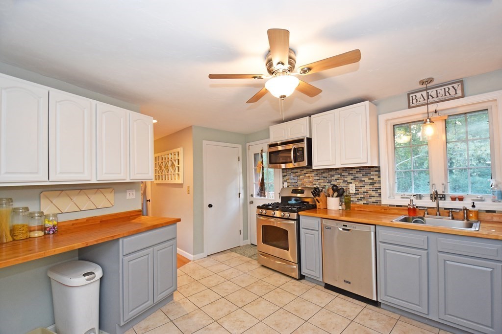 17 Ludlow Street Worcester, MA 01603 - Photo 6 of 23 a kitchen with stainless steel appliances a sink stove and cabinets