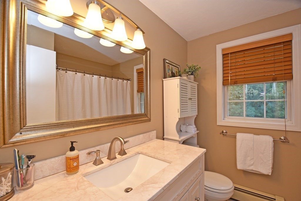 17 Ludlow Street Worcester, MA 01603 - Photo 9 of 23 a bathroom with a sink a toilet and tub