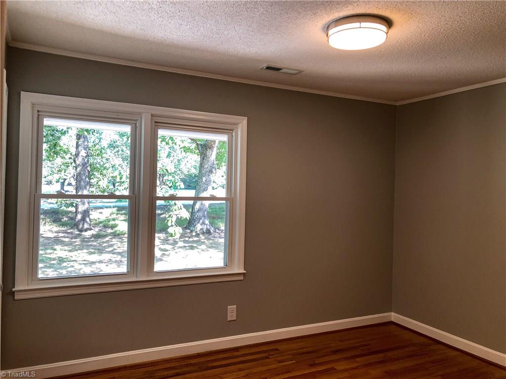328 Hartgrove Road King, NC 27021 - Photo 15 of 25 Bedroom 2 is on the front side of the home and on the upper level.