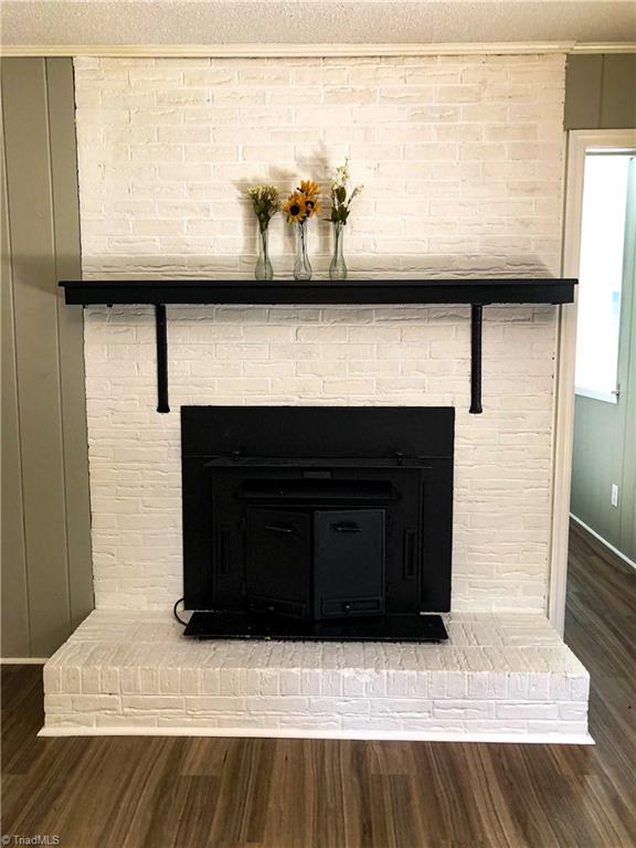328 Hartgrove Road King, NC 27021 - Photo 19 of 25 Fireplace in the den on the lower level.