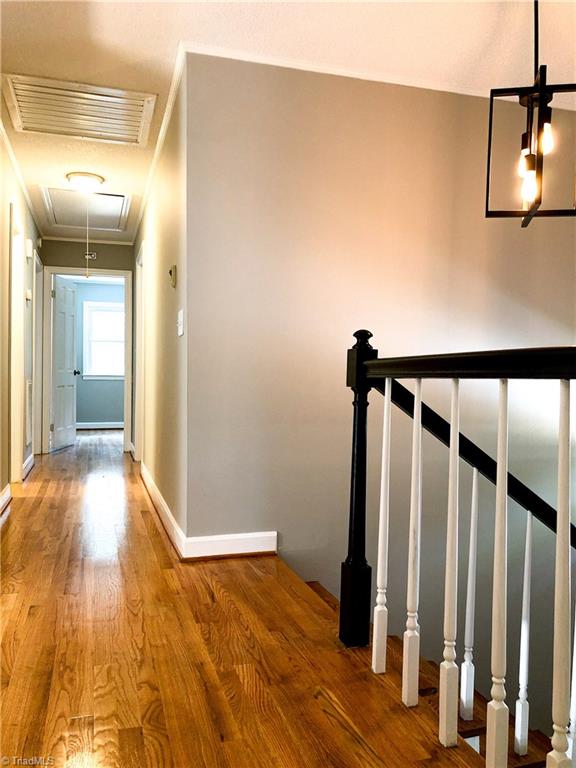 328 Hartgrove Road King, NC 27021 - Photo 10 of 25 Hallway on the upper level leading for breakfast room to bedrooms.