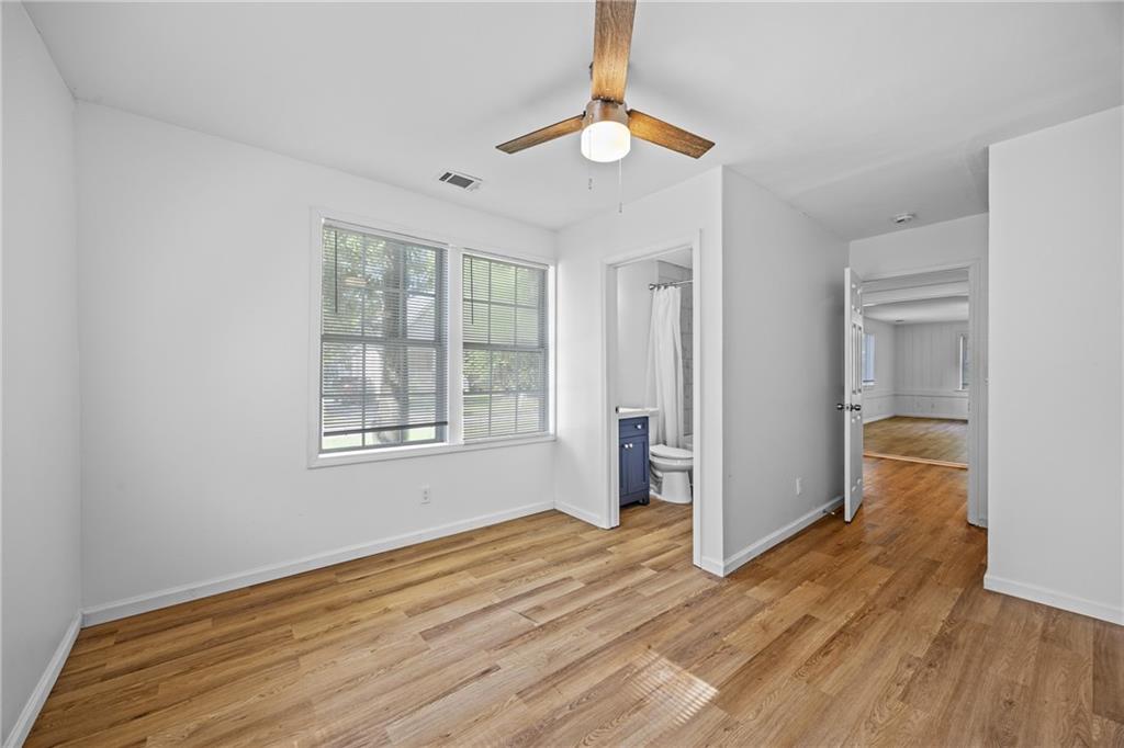 1339 Lyle Avenue Atlanta, GA 30344 - Photo 15 of 21 a view of an empty room with wooden floor and a window