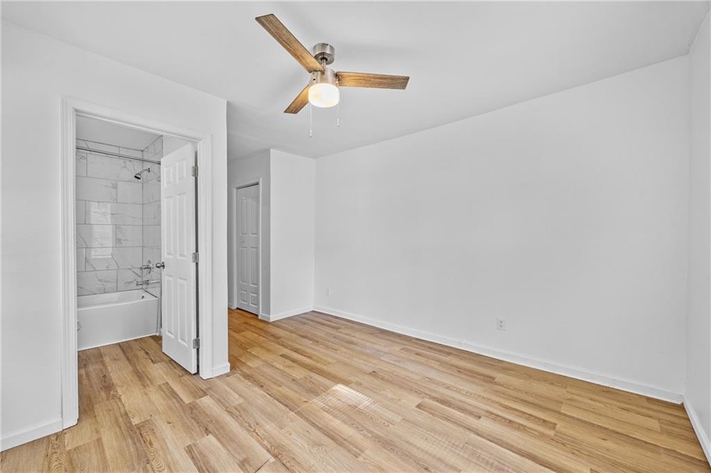 1339 Lyle Avenue Atlanta, GA 30344 - Photo 16 of 21 a view of an empty room with wooden floor and a window
