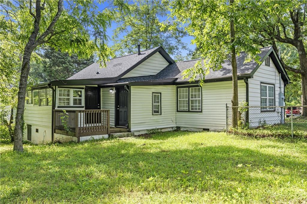 1339 Lyle Avenue Atlanta, GA 30344 - Photo 18 of 21 a view of a house with a yard and large tree