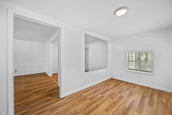 1339 Lyle Avenue Atlanta, GA 30344 - Photo 2 of 21 an empty room with wooden floor and windows